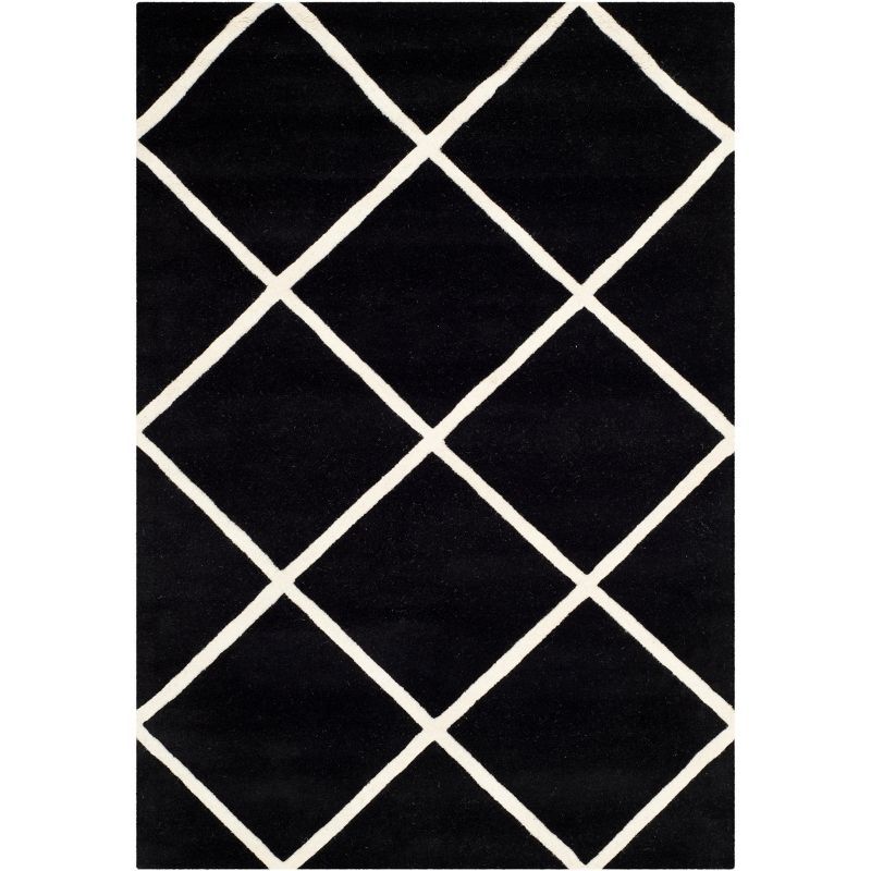 Handmade Black and Ivory Wool 4' x 6' Tufted Rug