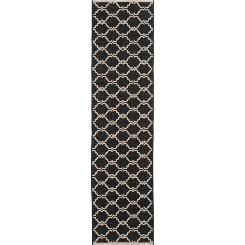 Courtyard Estelle 2'3" x 8' Black/Beige Synthetic Indoor/Outdoor Runner Rug