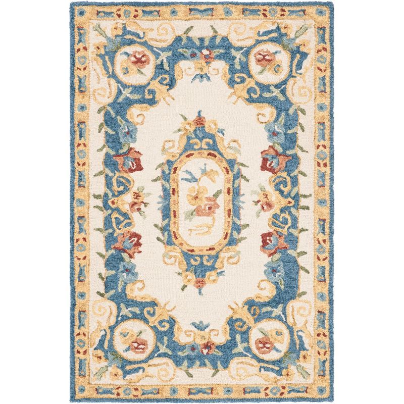 Handmade Cream and Blue Floral Wool Area Rug