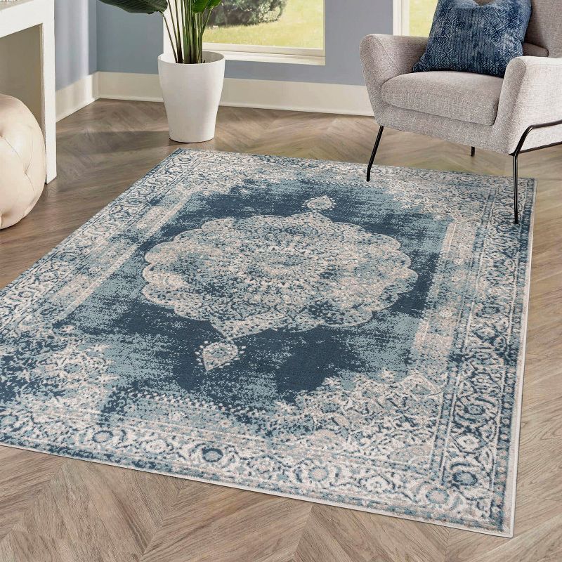 Ivory and Blue Medallion 8' x 10' Synthetic Area Rug