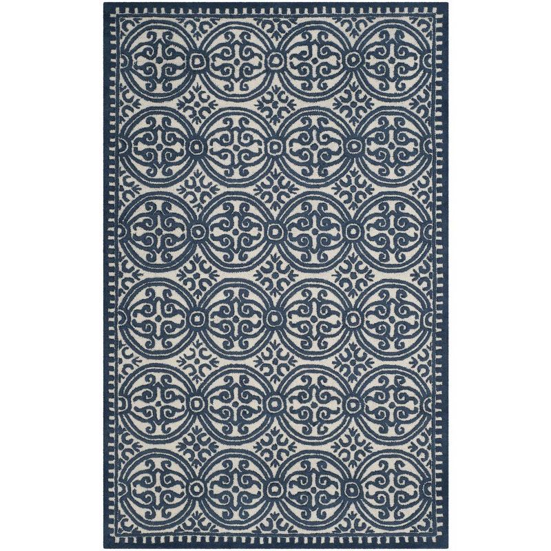 Ivory and Navy Geometric Wool 6' x 9' Handmade Tufted Rug