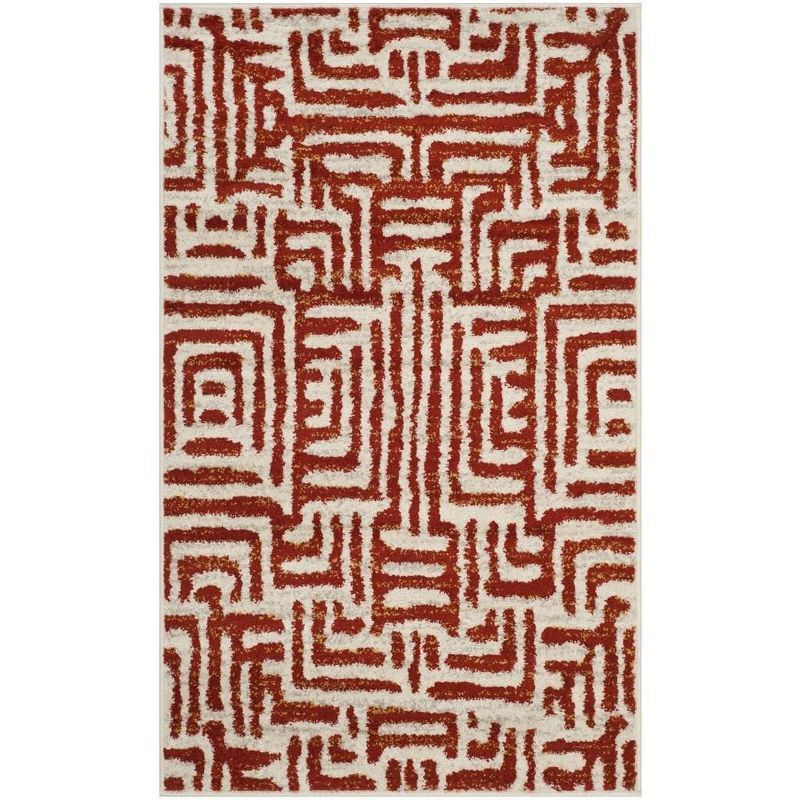 Ivory and Terracotta Geometric Synthetic Area Rug