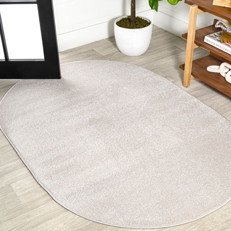 Ivory Oval Synthetic Low-Pile 3' x 5' Area Rug