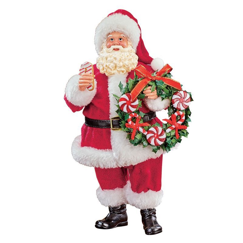 Festive Santa Claus Figurine with Candy Cane and Wreath