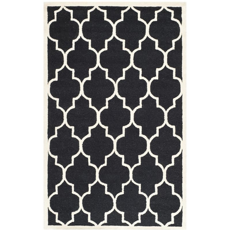 Handmade Black and Ivory Wool 6' x 9' Geometric Area Rug