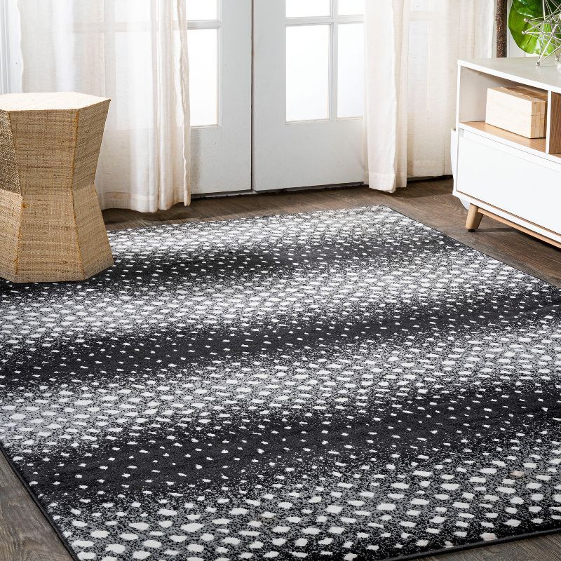 Abstract Antelope 8' x 10' Black and Ivory Synthetic Area Rug