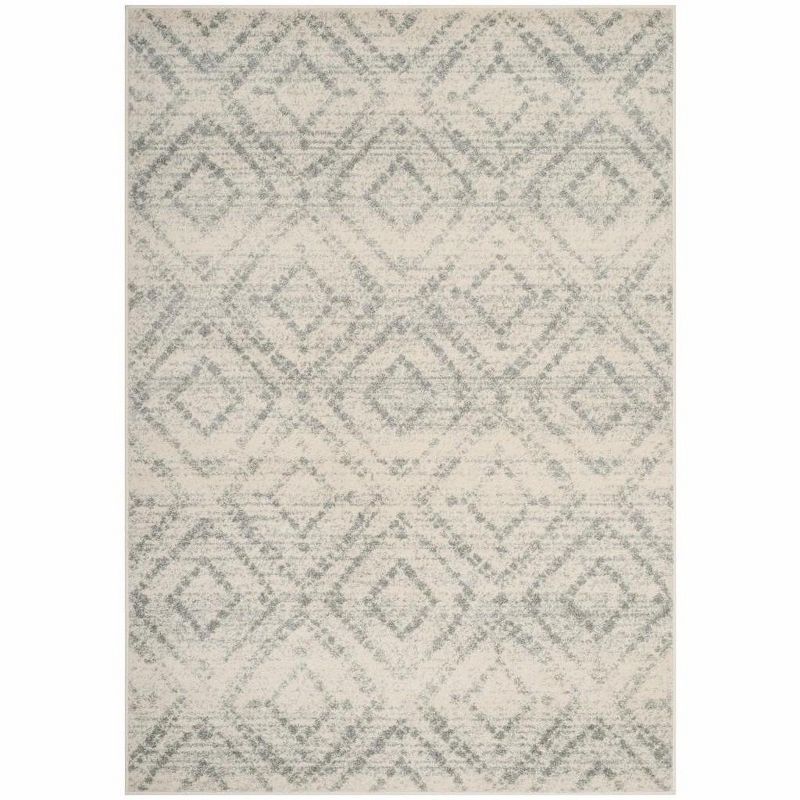 Ivory and Light Blue Geometric Synthetic 6' x 9' Area Rug