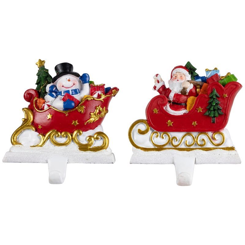 Santa and Snowman Sleigh Ride Resin Stocking Holders Set