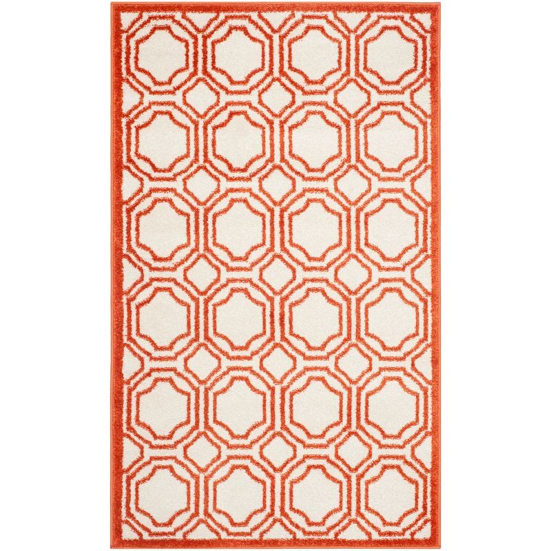 Ivory and Orange Geometric Synthetic 3' x 5' Reversible Area Rug