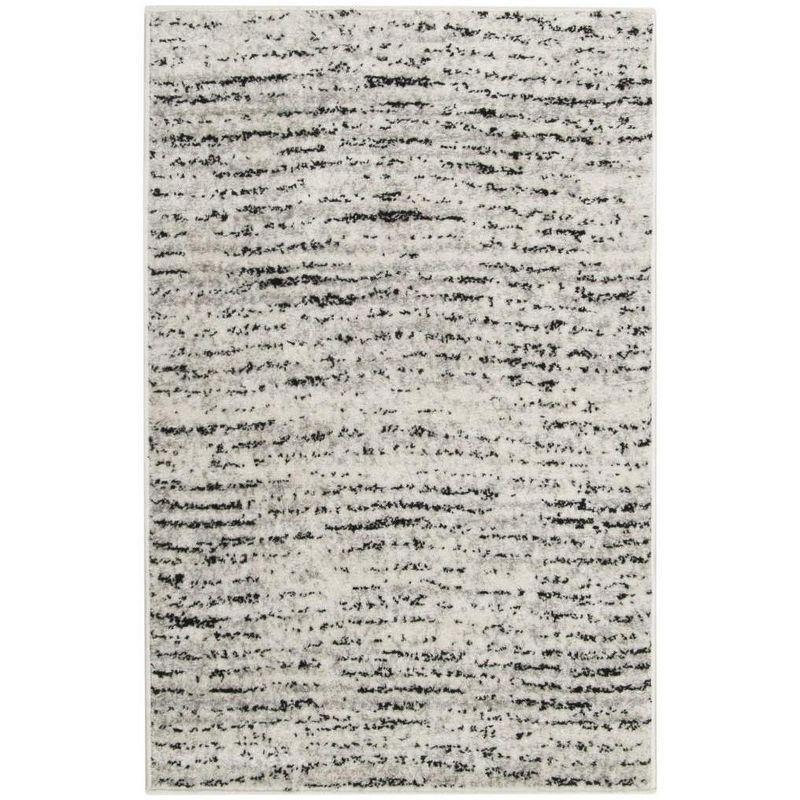 Ivory and Silver Abstract 10' x 14' Synthetic Area Rug