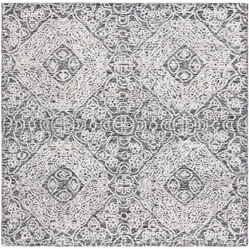 Handmade Black and Ivory Geometric Wool Area Rug