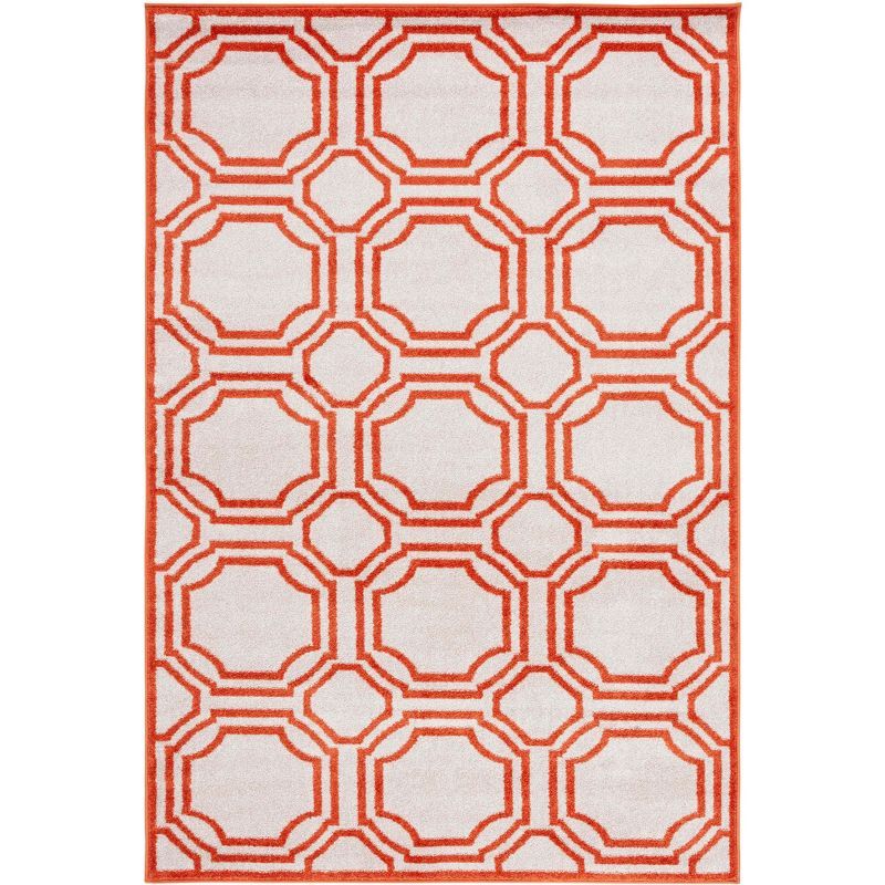 Ivory and Orange Geometric Synthetic Area Rug