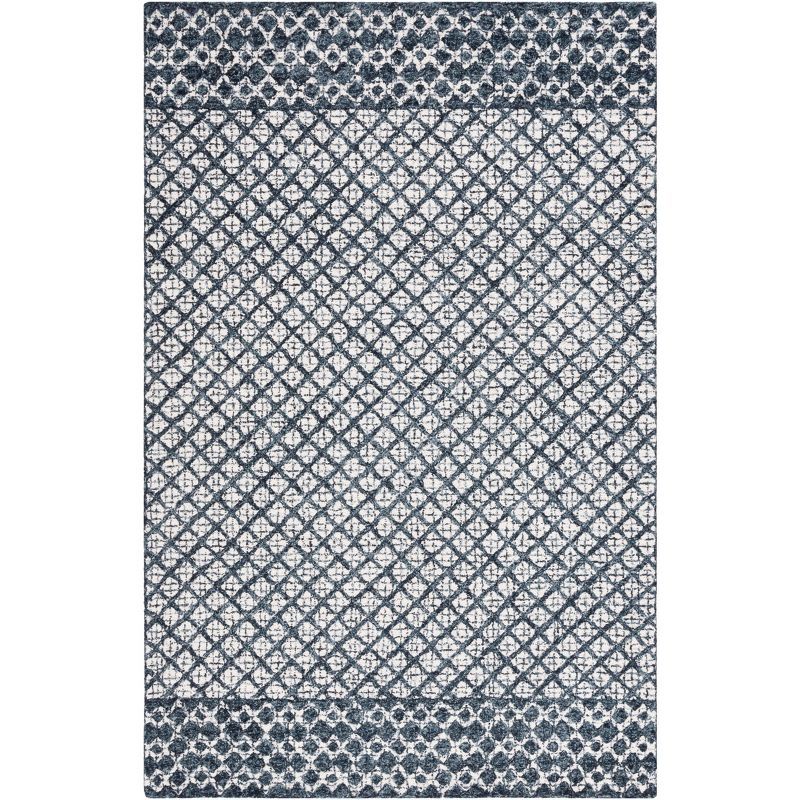 Ivory and Navy Tufted Wool Abstract Area Rug