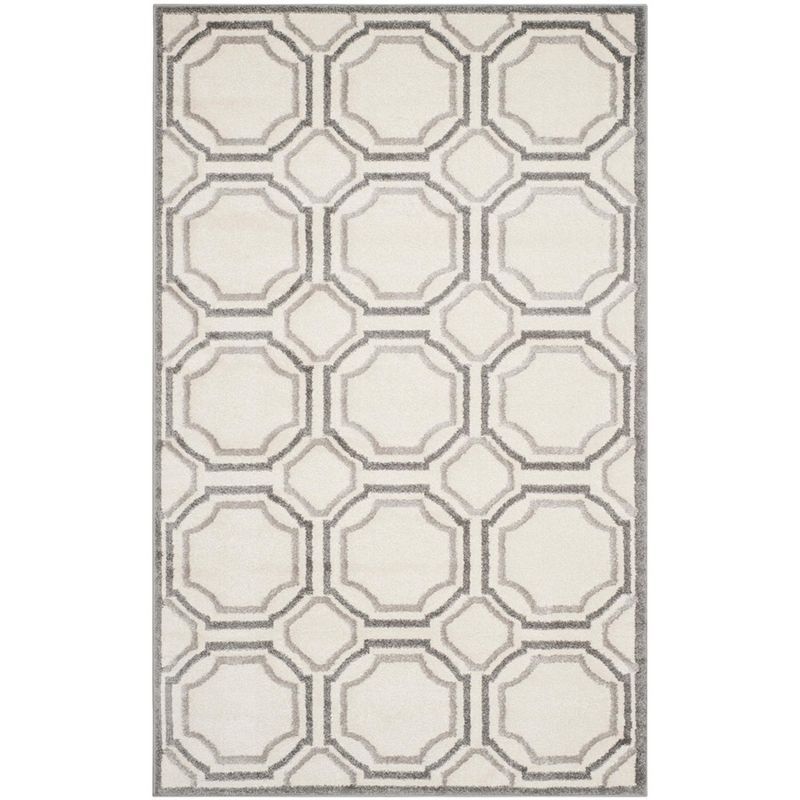 Ivory and Light Grey Geometric 4' x 6' Synthetic Area Rug