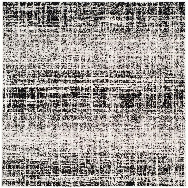 Ivory and Black Abstract Square Synthetic Accent Rug 4'x4'