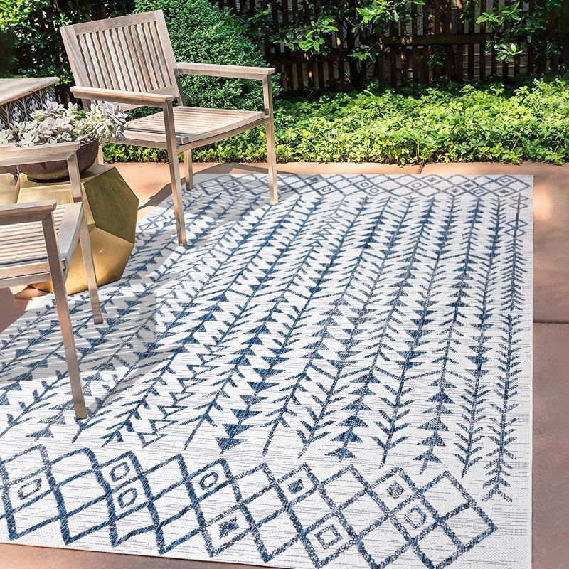 Ivory and Blue Geometric Synthetic 3' x 5' Area Rug