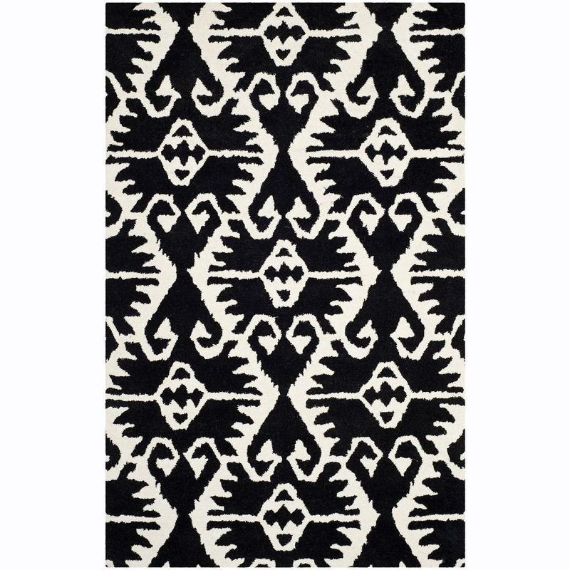 Handmade Black and Ivory Wool Tufted Area Rug, 5' x 8'