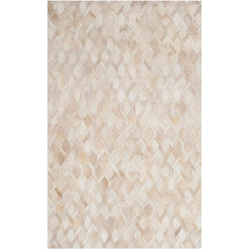 Handmade Ivory Geometric Cowhide 5' x 8' Area Rug