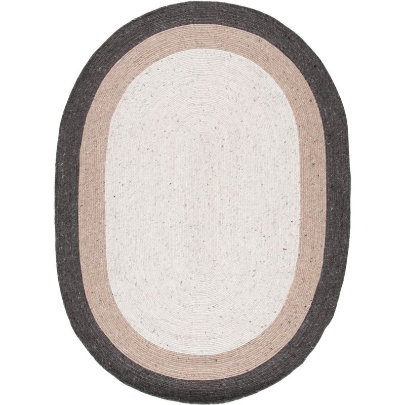 Handwoven Ivory Wool 8' x 10' Oval Braided Reversible Rug