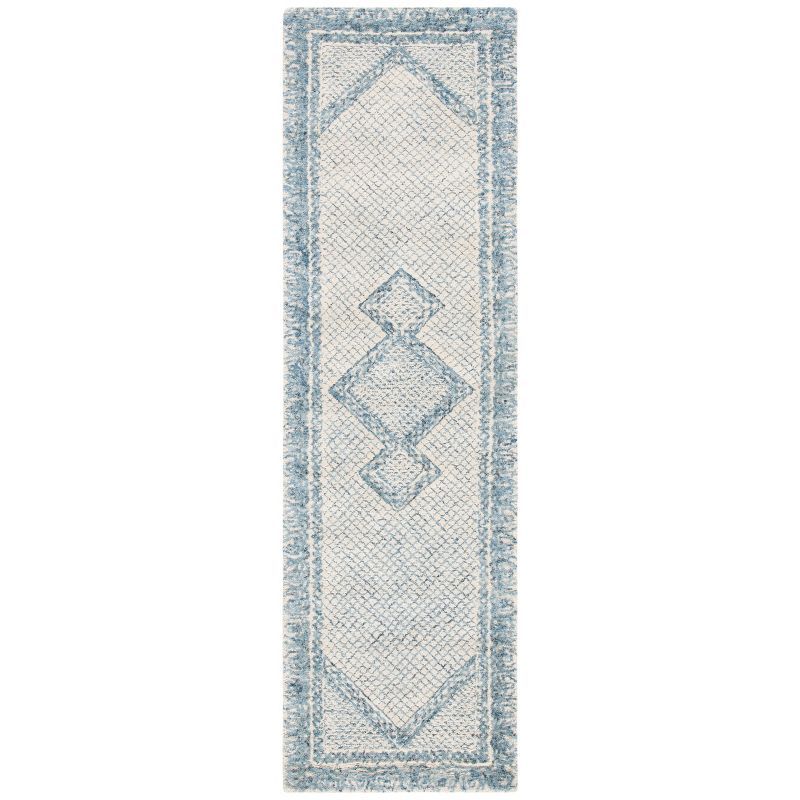 Handmade Blue and Ivory Wool Abstract Tufted Rug