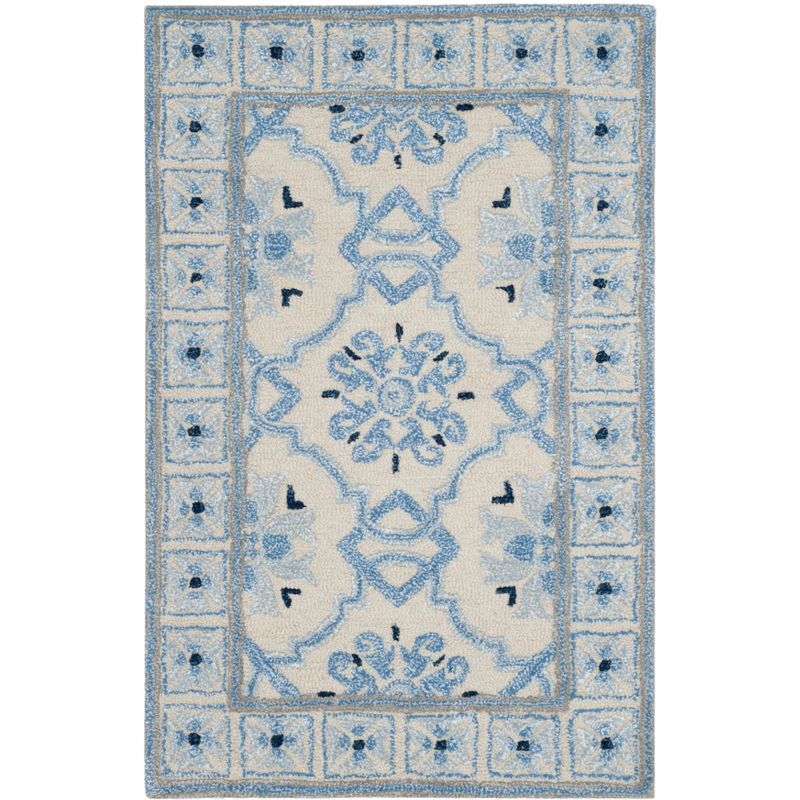 Handmade Ivory and Blue Wool Viscose Tufted Area Rug