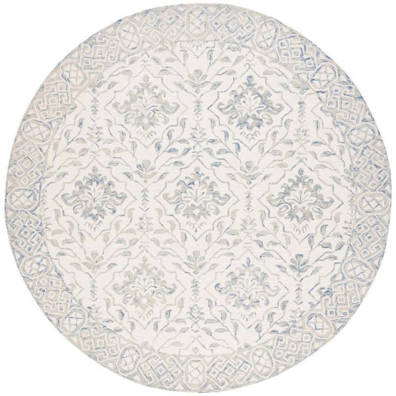 Handmade Light Blue and Ivory Round Wool Area Rug