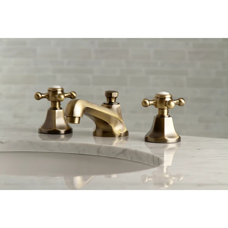 Kingston Brass Metropolitan Two-Handle 3-Hole Deck Mount Widespread Bathroom Faucet with Brass Pop-Up Drain