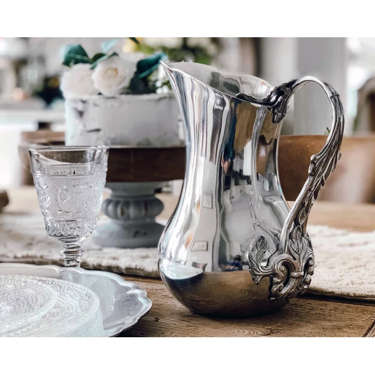 Ornate Silver Aluminum Pitcher with Fleur-de-Lis Handle