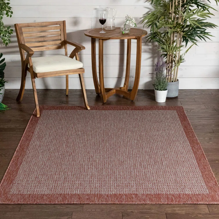 Marshanna Odin Solid Striped Border Indoor Outdoor Coral Flatweave Rug