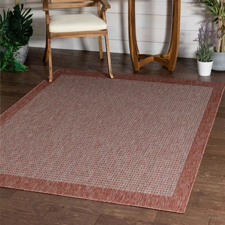 Marshanna Odin Solid Striped Border Indoor Outdoor Coral Flatweave Rug
