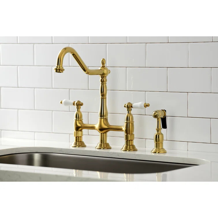 Kingston Brass Heritage Two-Handle 4-Hole Deck Mount Bridge Kitchen Faucet with Brass Side Sprayer