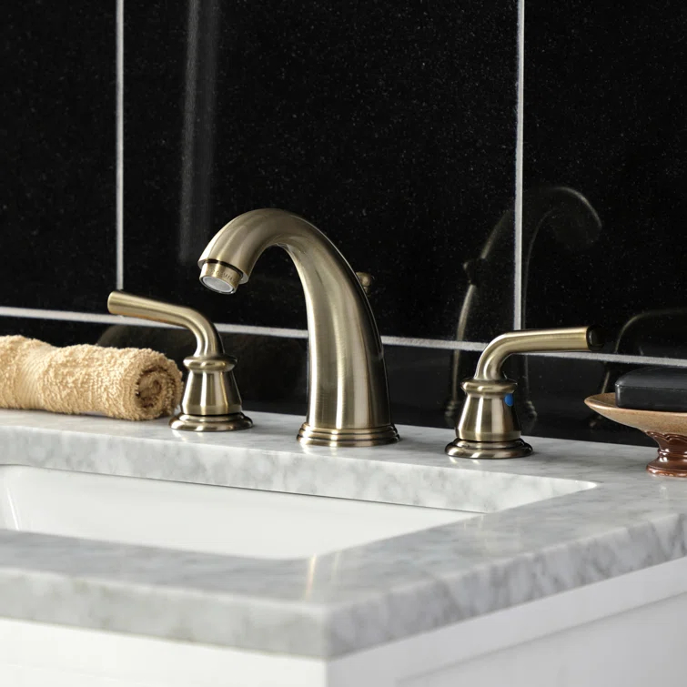 Kingston Brass Restoration Two-Handle 3-Hole Deck Mount Widespread Bathroom Faucet with Retail Pop-Up Drain