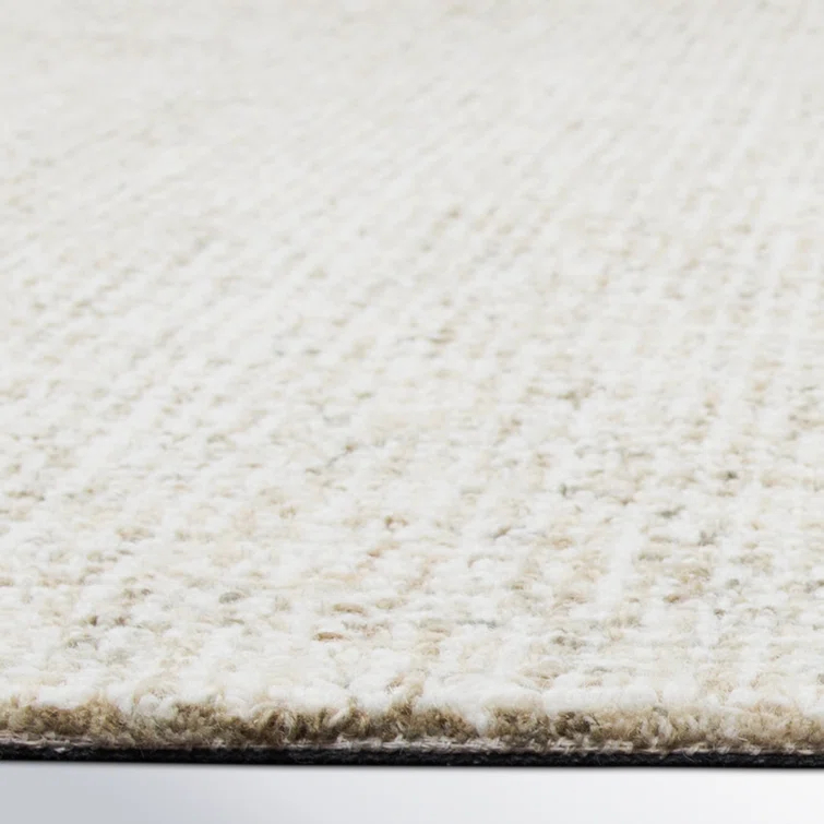 Britley Handmade Tufted Wool Beige Area Rug