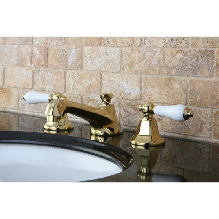 Kingston Brass Metropolitan Two-Handle 3-Hole Deck Mount Widespread Bathroom Faucet with Brass Pop-Up Drain