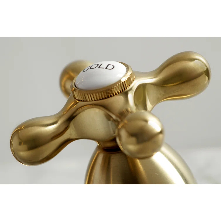 Kingston Brass Heritage Two-Handle 3-Hole Deck Mount Widespread Bathroom Faucet with Brass Pop-Up Drain