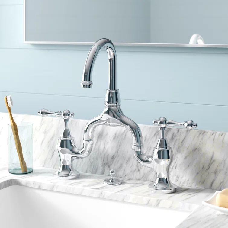 Kingston Brass English Country Two-Handle 3-Hole Deck Mount Bridge Bathroom Faucet with Brass Pop-Up