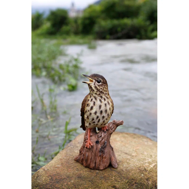 Songbird Standing on Stump Statue