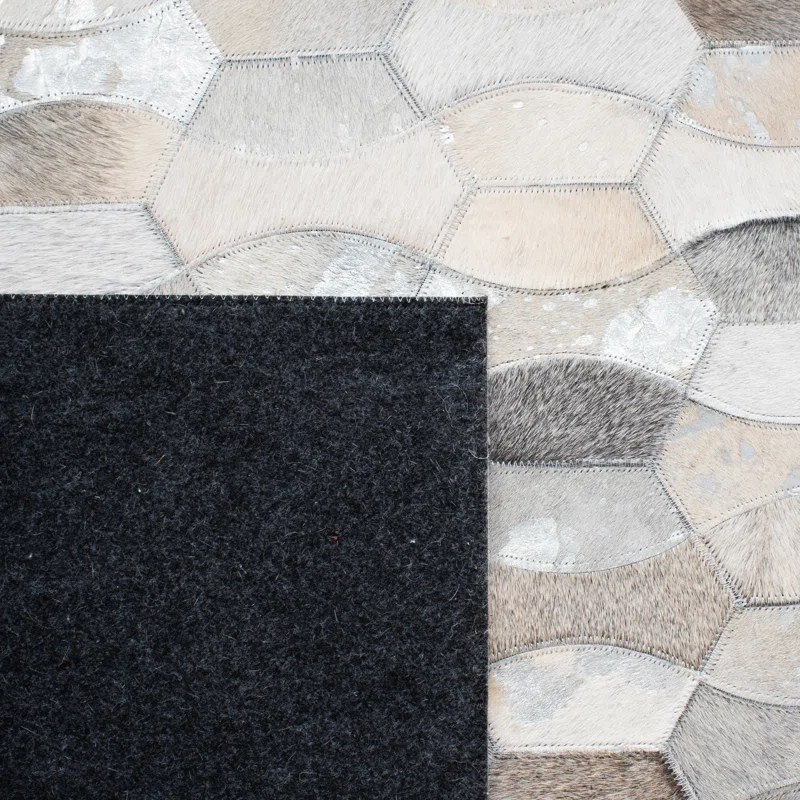 Loon Peak® Belday Flat Weave Hair On Leather Rug