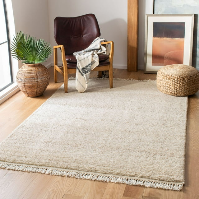 SAFAVIEH Casablanca Carbrey Solid Wool Shag Area Rug, Beige, 4' x 6'
