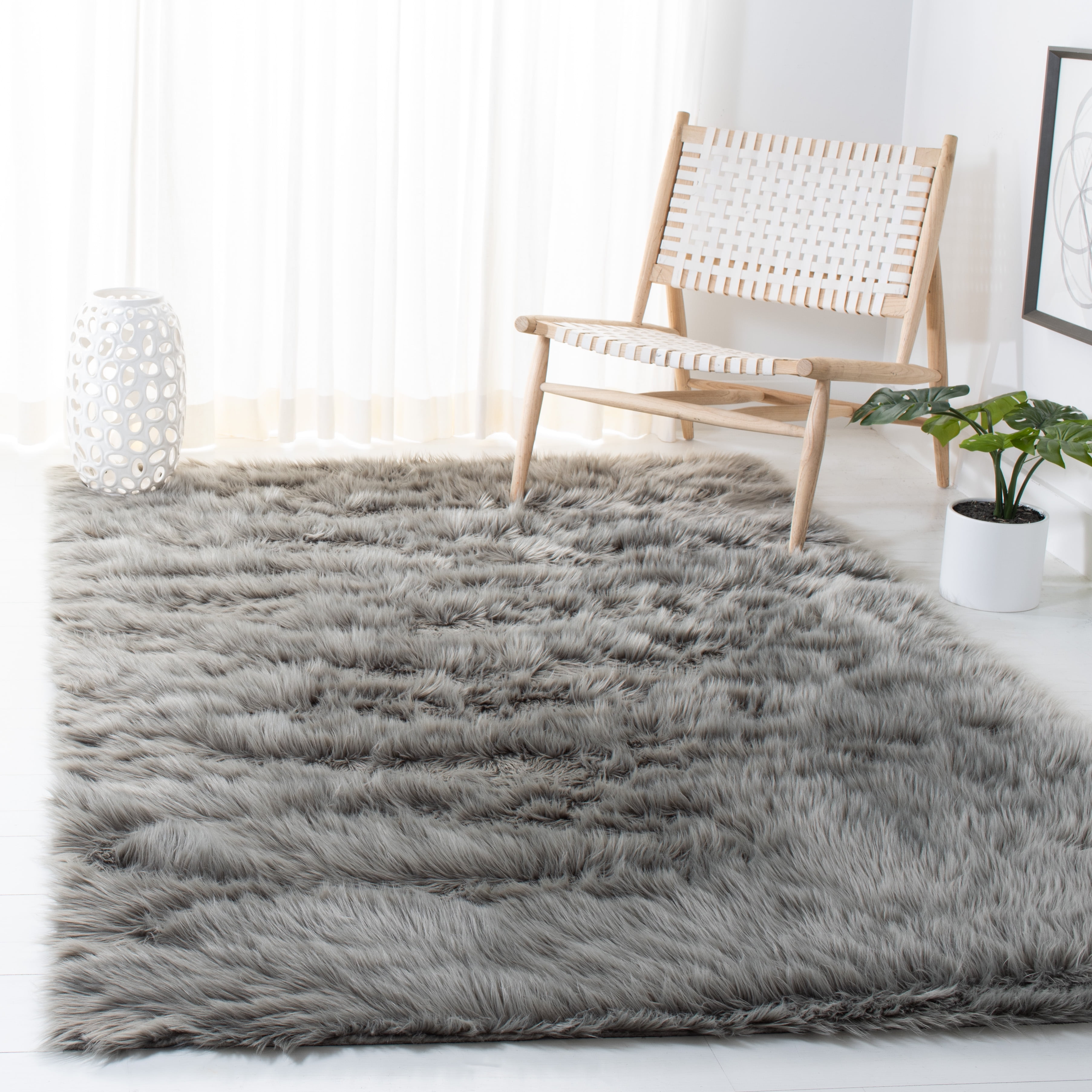 SAFAVIEH Faux Sheep Skin Vesna Solid Area Rug, Grey, 2' x 3'
