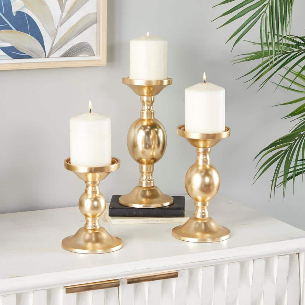 Deco 79 Aluminum Metal Decorative Candle Holder Pillar Candle Stand, Set of 3 Candlestick Holder 10", 8", 6"H, Gold
