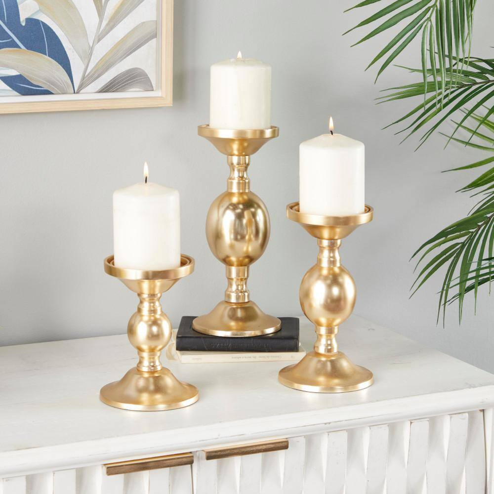 Deco 79 Aluminum Metal Decorative Candle Holder Pillar Candle Stand, Set of 3 Candlestick Holder 10", 8", 6"H, Gold