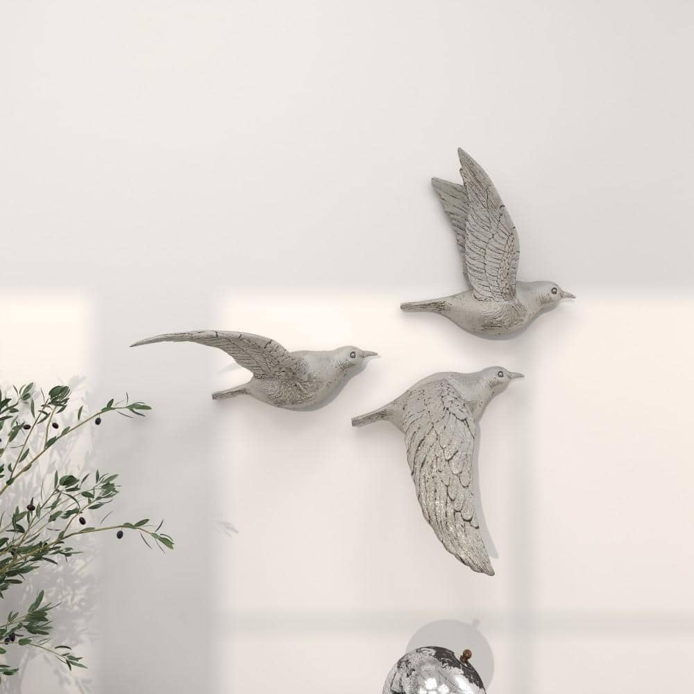 DecMode Silver Polystone Metallic 3D Sculpted Bird Wall Decor (3 Count)