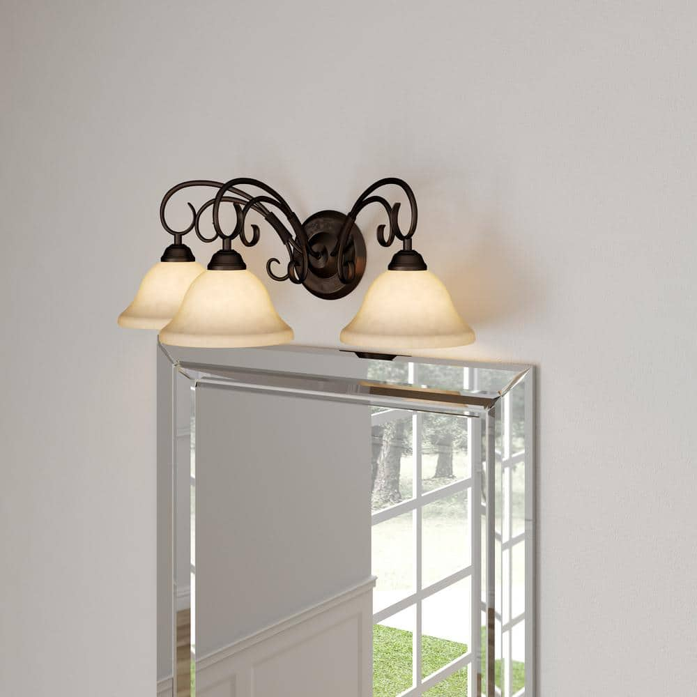 Golden Lighting Homestead 3-Light Vanity Light in Rubbed Bronze with Tea Stone Glass
