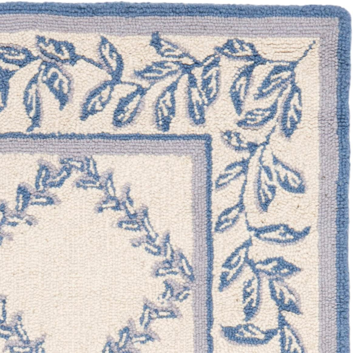 SAFAVIEH Chelsea Alecia Geometric Borders Wool Area Rug, Ivory/Light Blue, 2'6" x 4'