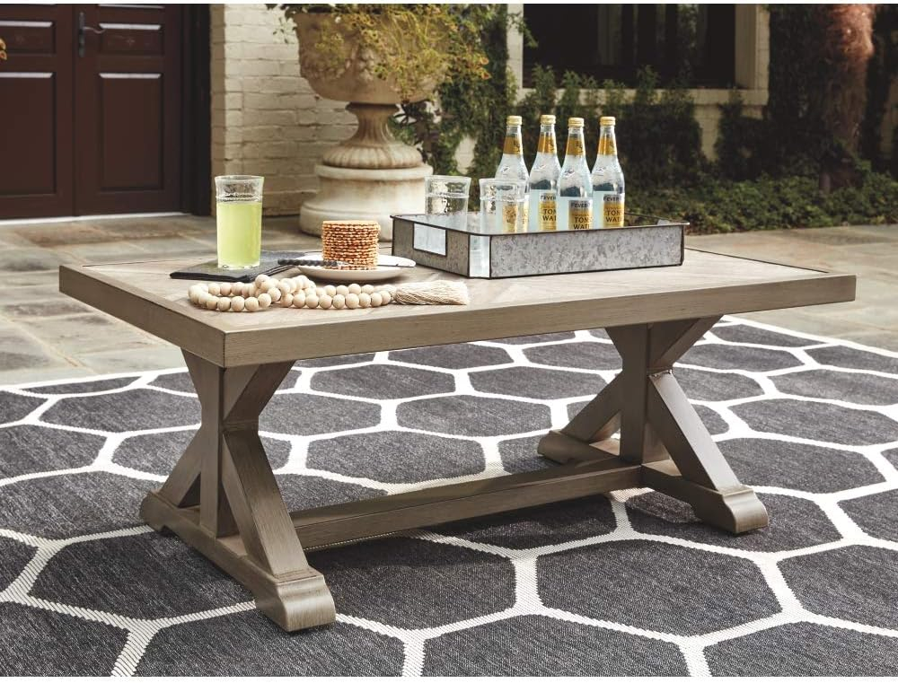 Signature Design by Ashley Beachcroft Outdoor Coffee Table - Porcelain Top with Aluminum Base - Beige