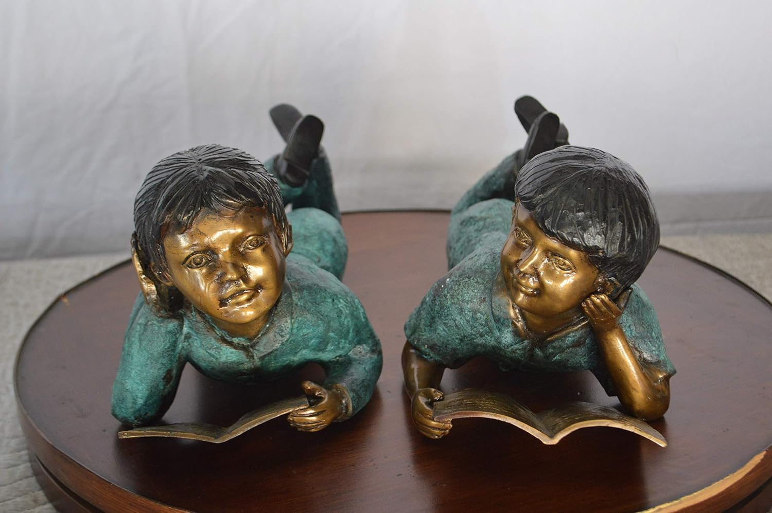 Set of a Boy and a Girl Reading a Book Bronze Statue - Size: 16"L x 7"W x 8"H.