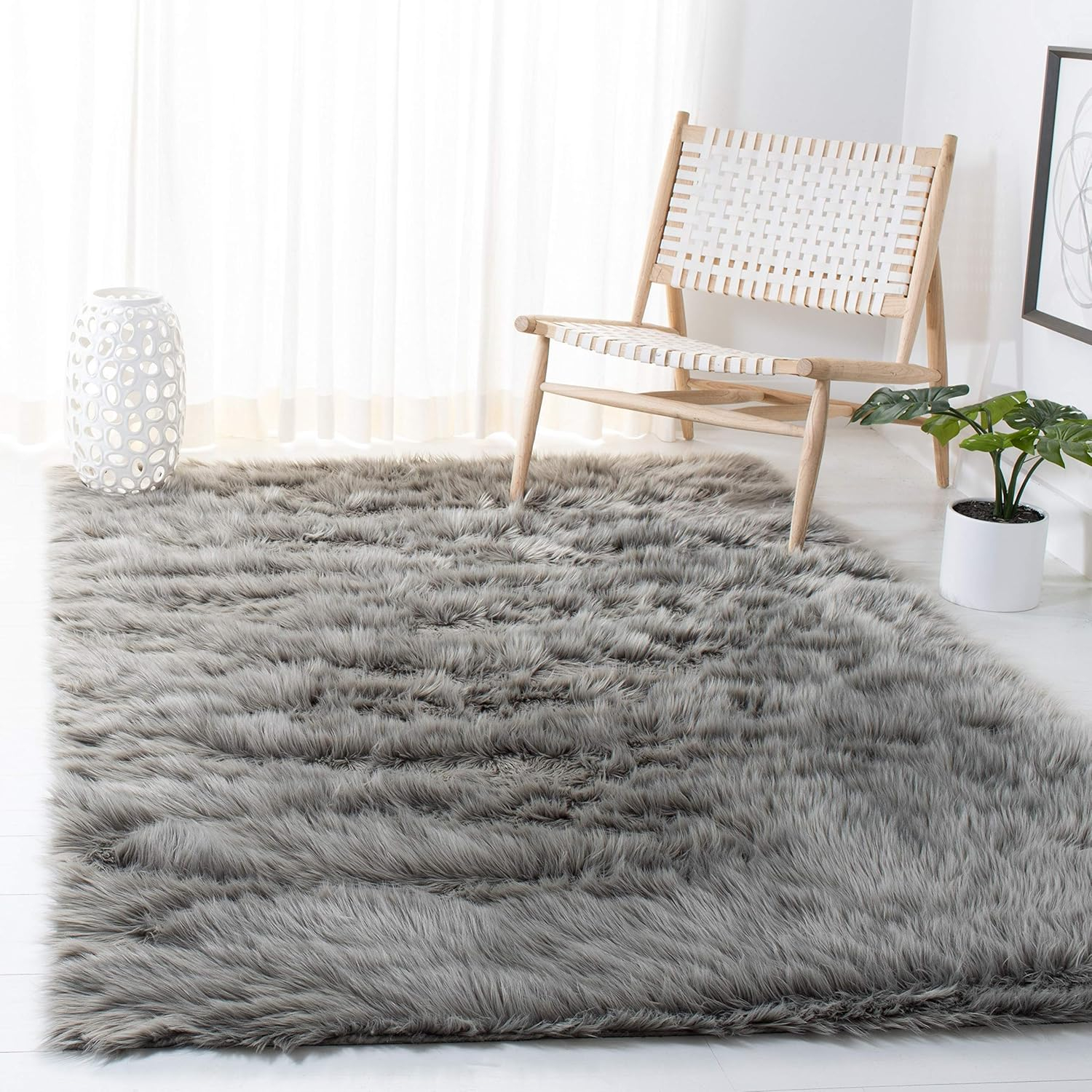 SAFAVIEH Faux Sheep Skin Vesna Solid Plush Area Rug, Ivory, 8' x 10'