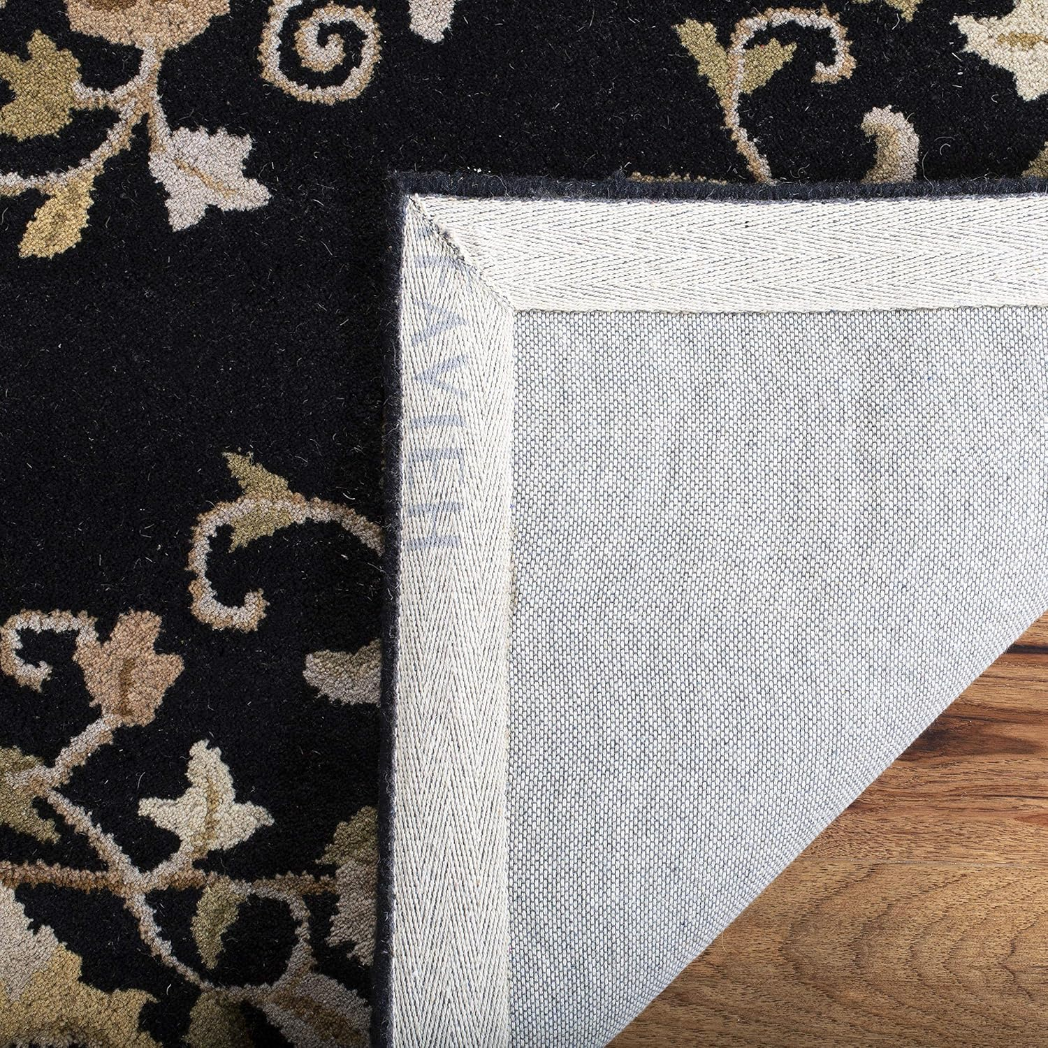 Handmade Black Oval Wool and Cotton Tufted Rug