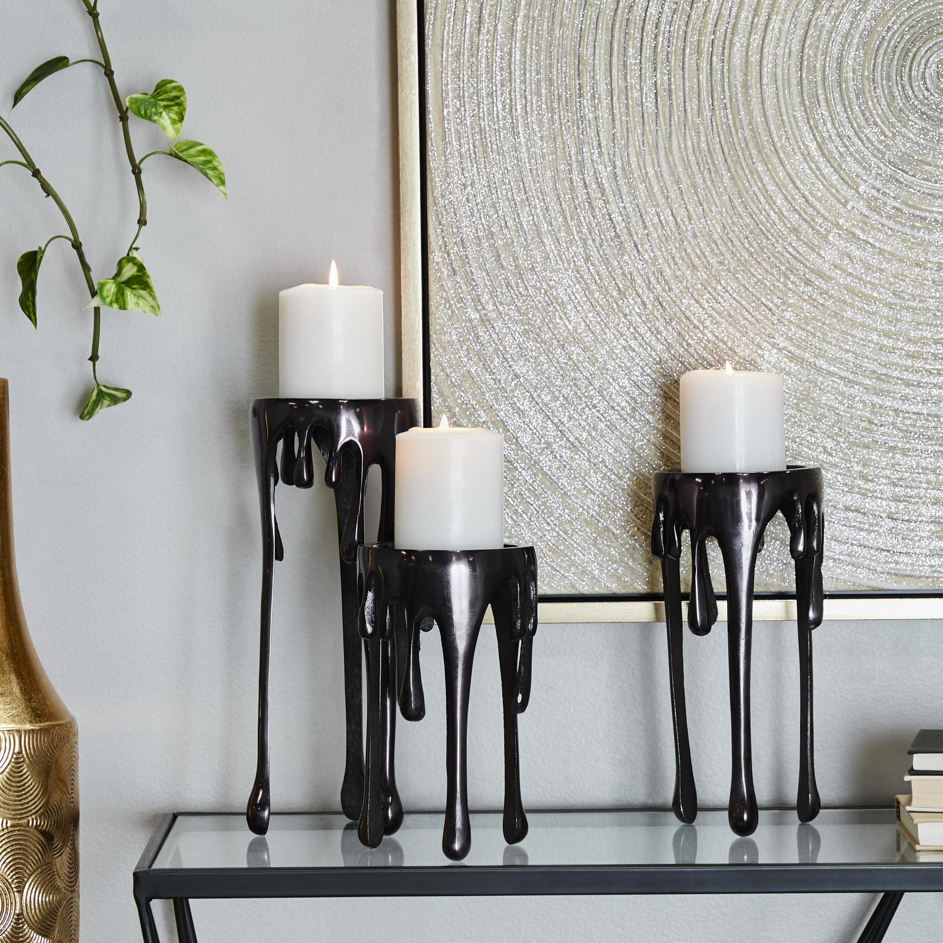 CosmoLiving by Cosmopolitan Contemporary Aluminum 3D Melting Candle Design Candle Holder, Set of 3 12" 10" 8" with Glossy Metallic Black Finish